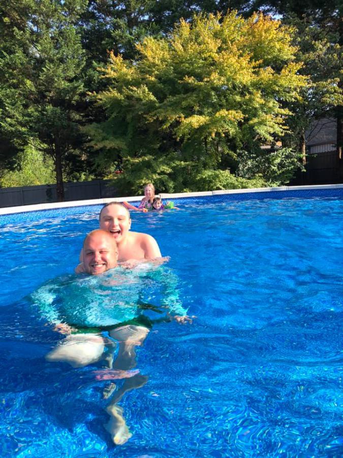 Corey and Dad enjoying the pool