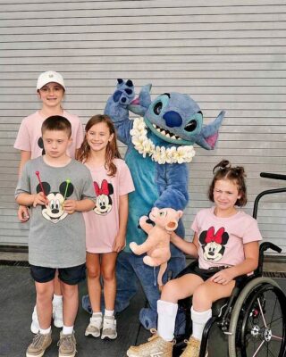 Emory and family with Stitch at Disney World