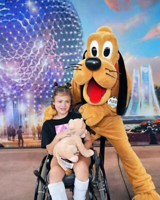 Emory with Pluto at Disney World